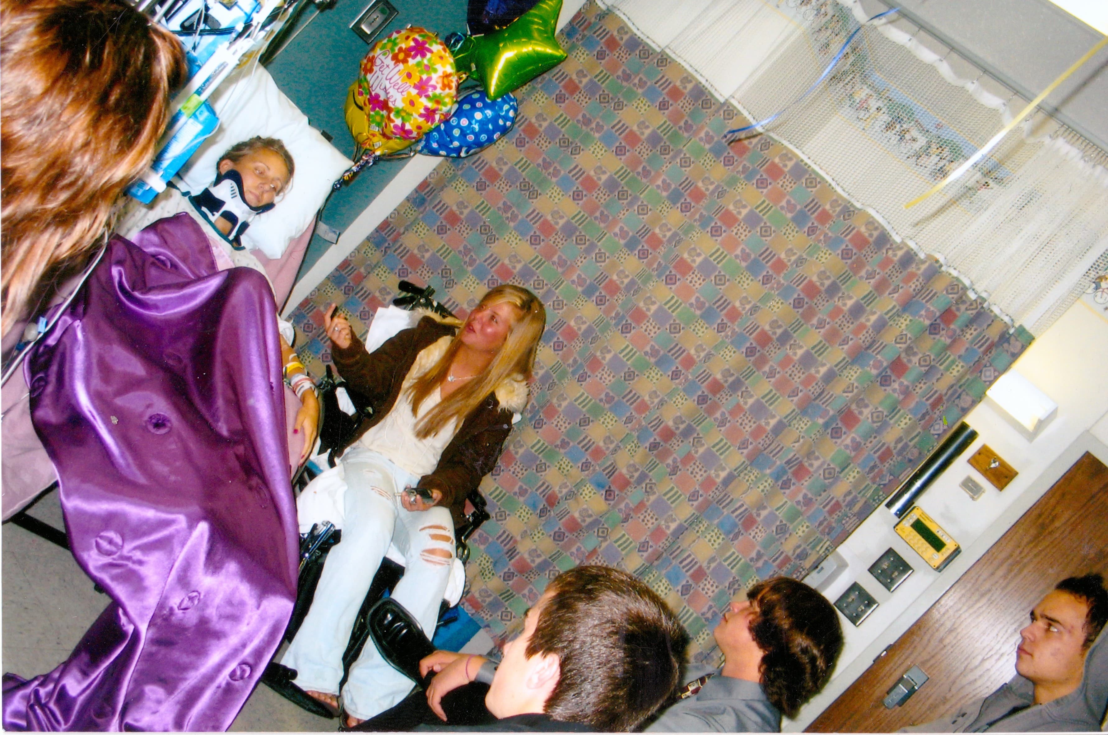 Surrounded by friends and family in the hospital, I celebrated Homecoming in my own way. Since I couldn't wear my dress, my mom brought a special, shiny purple blanket to mark the occasion.