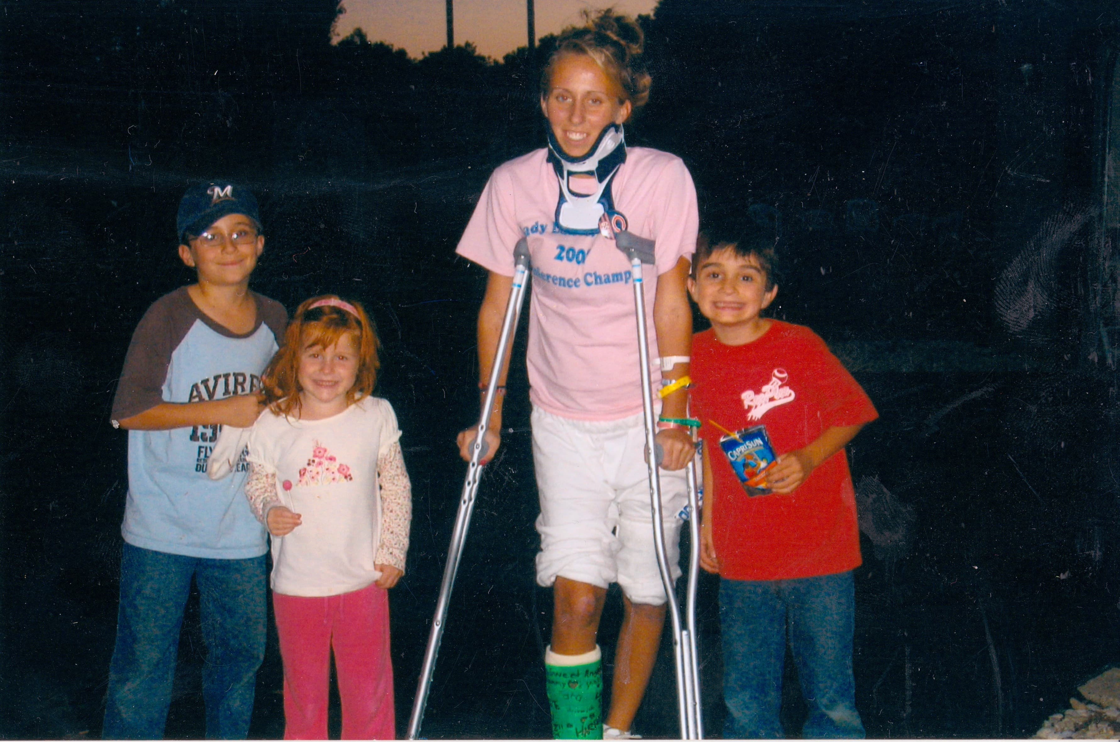 The day I returned home from the hospital for the first time since the accident. My younger siblings waited in the driveway to welcome me back. I was overwhelmed with happiness the moment I saw their smiles. Pictured here are Christopher (Fur), Kara, and Jay.
