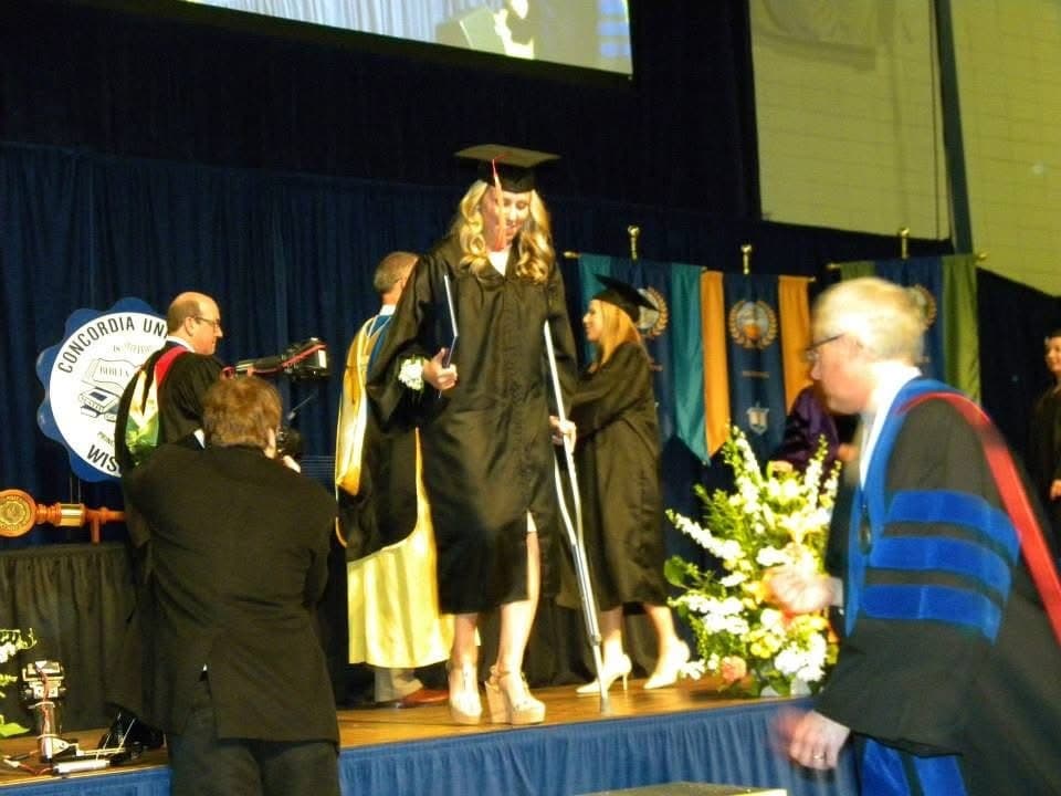 Walking across the stage to receive my diploma, filled with excitement and optimism about the future ahead.