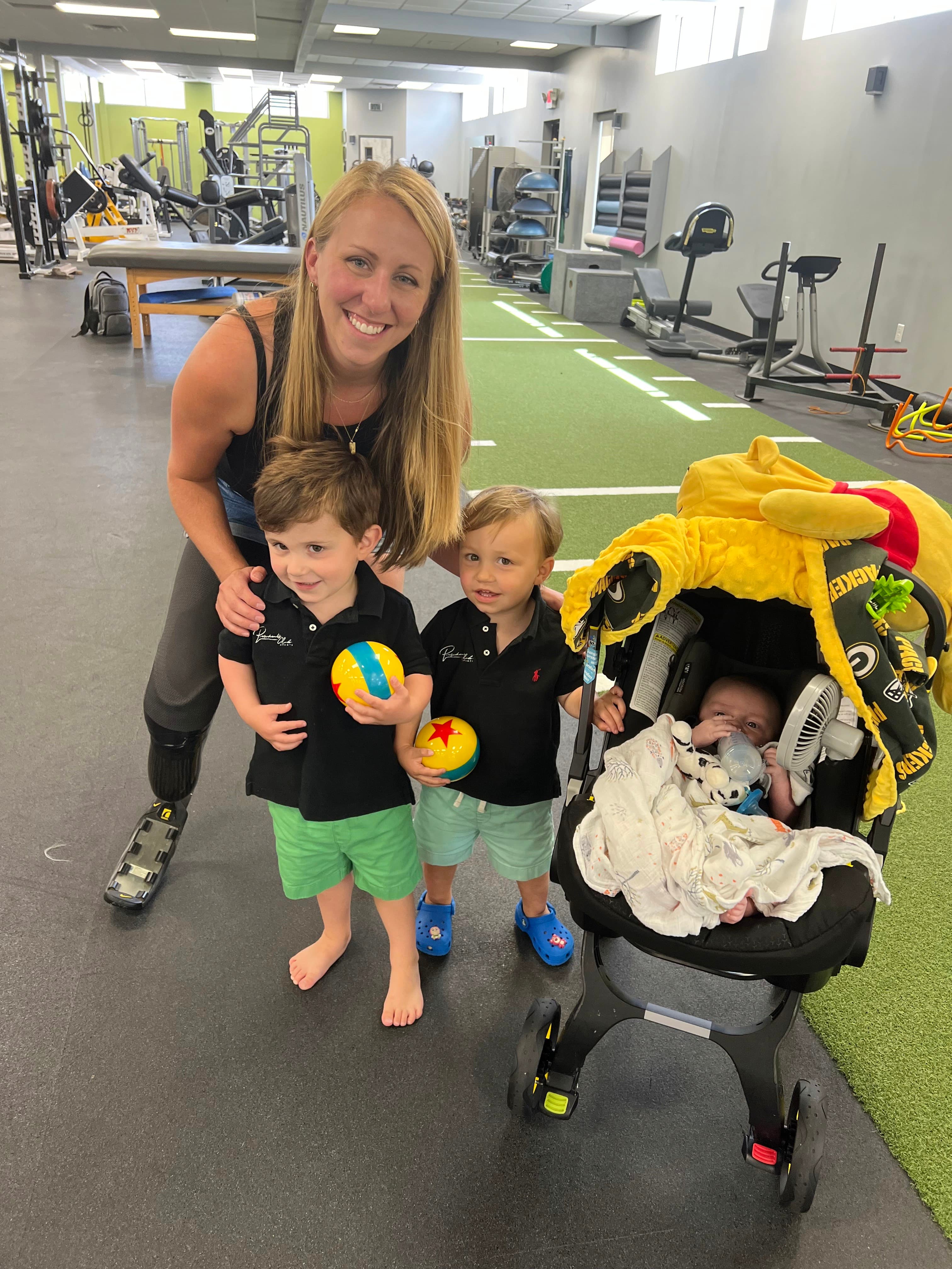 My first visit to POA as a mom of three, just two months postpartum. With three little ones to chase after, my prosthetic fittings became more frequent—I had to stay one step ahead! Pictured with me are Gordon, Teddy, and our newest addition, baby Jackson.