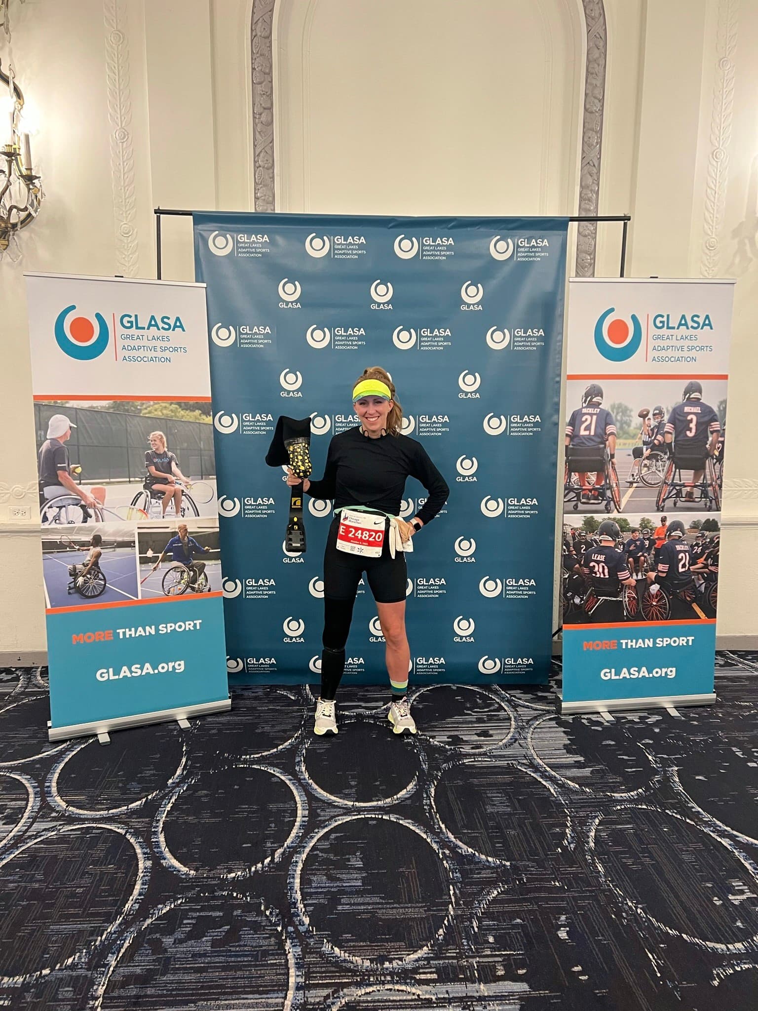 10:43 am – My one and only "leg stop" during the Chicago Marathon—mile 15, right at Charity Mile, where our amazing family was waiting with my gear. Pictured here is Gordon proudly holding up my running blade as I swapped out silicone liners. With a quick kiss to the kids, I smiled and said, "See you in 11 miles!"