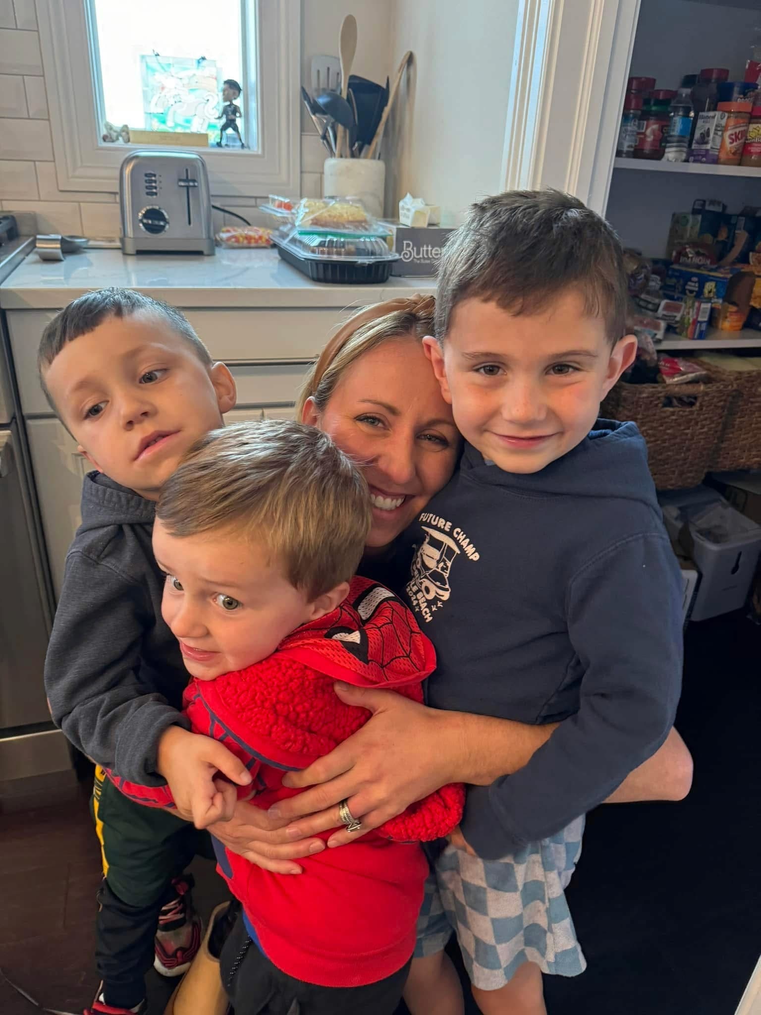 One of my many visits to POA. A new prosthetic fitting for mom is always a family affair, and the kids love being part of the process. Pictured with me are Gordon, Teddy and Jackson.